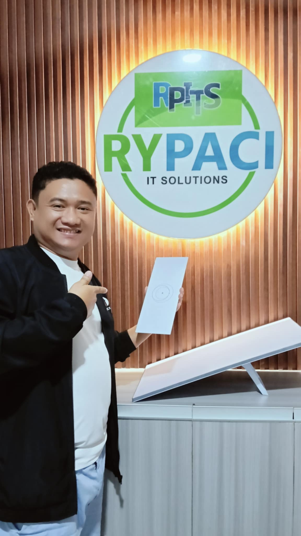 a picture of rypaci Ceo and company logo is the background 